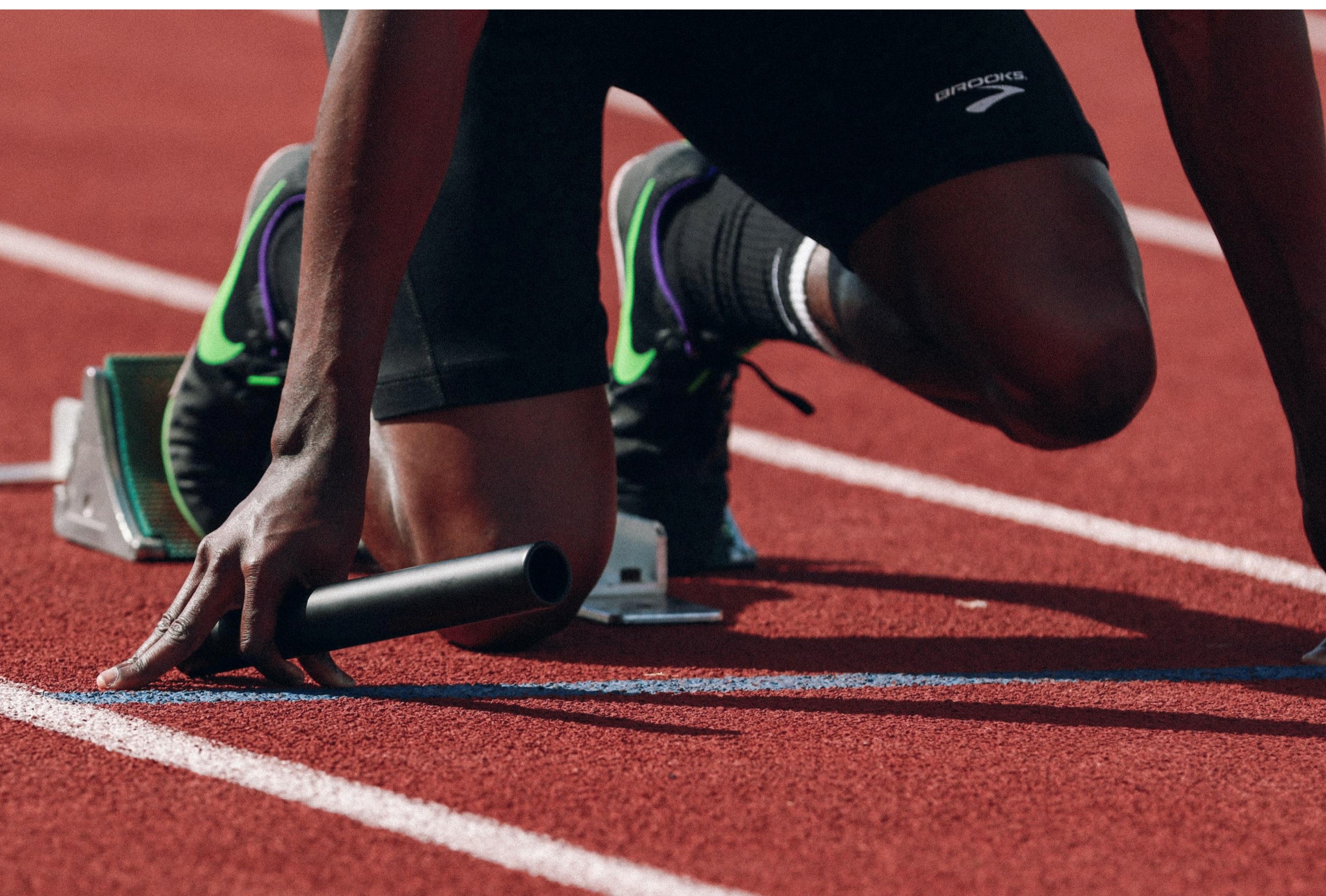  a runner's knees, about to take off in a race